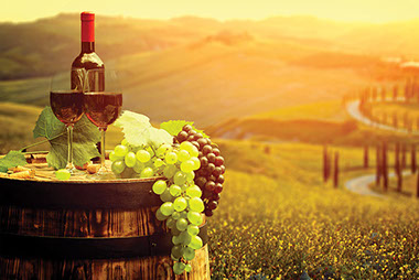 Wine confusion - healthy or not? Image of a wine bottle with 2 glasses of wine and grapes.