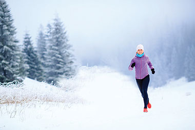 Image of young women jogging in the winter.