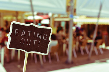 Image of sign that says 'Eating Out'