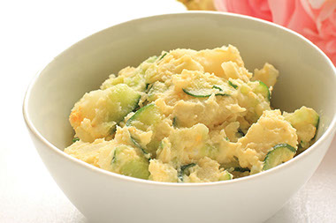 A dish filled with potato salad.