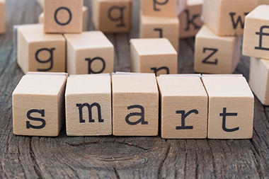 Image of wood blocks with letters spelling "smart."