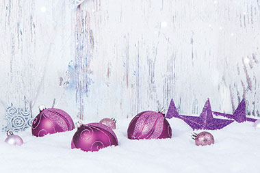 Image of ornaments in the snow.
