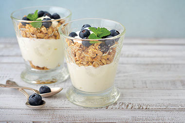 Image of yogurt with granola and berries.