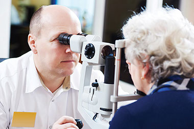 Image of eldery women getting her eyes checked.