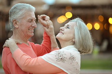 Image of older couple dancing.
