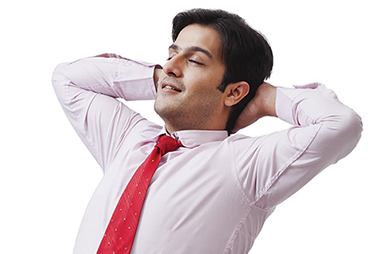 Deep breathing exercise to manage stress. Image of business man deep breathing.