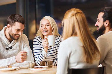Image of 2 couples having lunch.