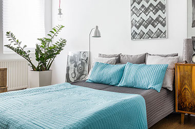 Bed with blue bedding.