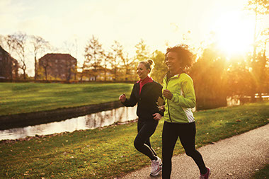 Get back into the exercise habit. Image of 2 females jogging.