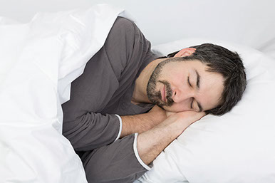 Image of man sleeping.