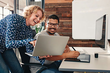 Image of co-workers talking.