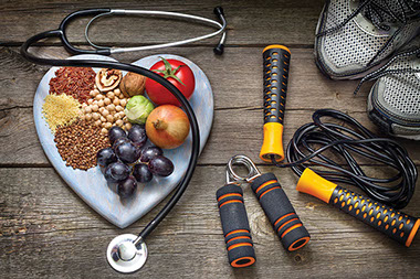 Image of heart plate with heart healthy foods and fitness gear. Image of heart plate with heart healthy foods and fitness gear.