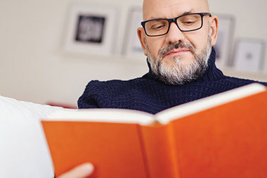 Man reading a book.