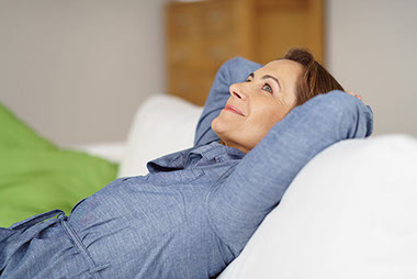 Image of women relaxing while thinking.