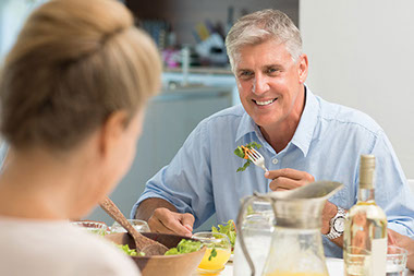 Image of man eating dinner.