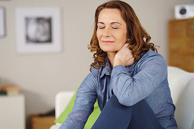 Women sitting with eyes closed and relaxed.