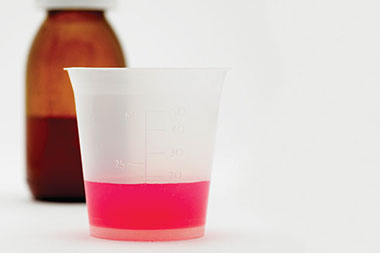 Over-the-counter overdosing? Image of liquid medicine.