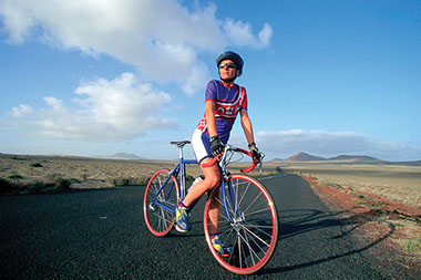 Image of women on bike.