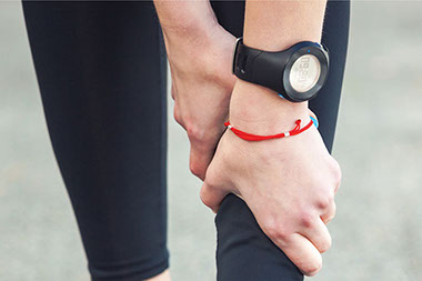 Close up images of hands holding shins in pain.