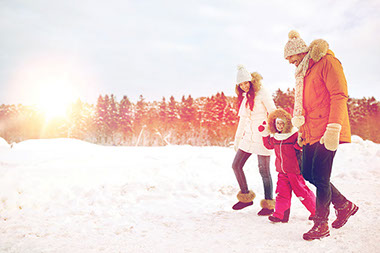 Image of family walking outside in the snow.