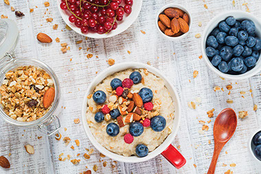 Image of a bowl of oatmeal with berries and almonds.
