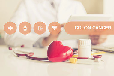 Image of doctors desk with the words 'Colon Cancer'.