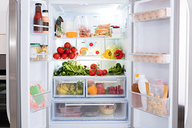 Refrigerator filled with fresh fruits and vegetables. Refrigerator filled with fresh fruits and vegetables.