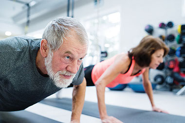 Image of man and women doing pushups. Image of man and women doing pushups.