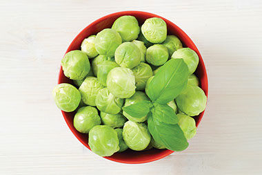 Brussels spouts in red bowl.