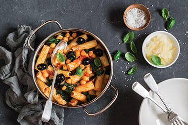 Pasta with chickpeas, tomato and spinach.