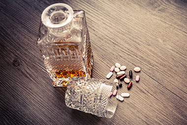 Image of alcohol and pills.