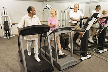 Image of 3 senior citizens walking on treadmills.