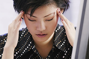 Image of women with a headache.