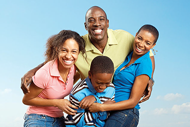 Image of happy, laughing family.