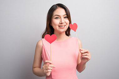 Woman holding red heart shape. Woman holding red heart shape.