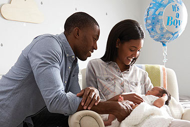 Young couple holding newborn. Young couple holding newborn.