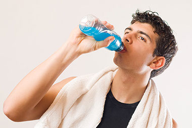 Image of man rehydrating with liquids. Image of man rehydrating with liquids.