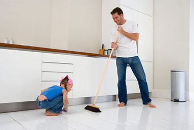 Image of father and daugher cleaning.