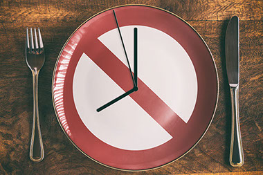 Concept image of plate with "DO NOT" sign and clock hands. Concept image of plate with "DO NOT" sign and clock hands.