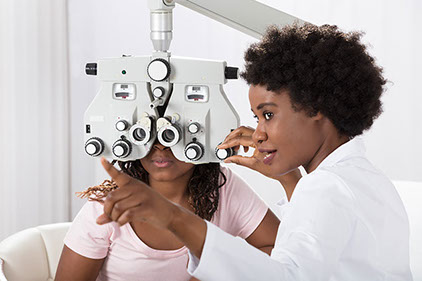 Eye Care. Image of eye doctor with patient.