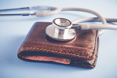 Wallet with stethoscope.