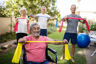 Group of friends outside exercising.