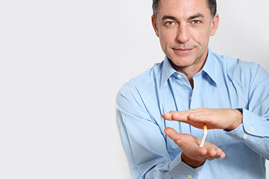 Image of man crushing a cigarette.