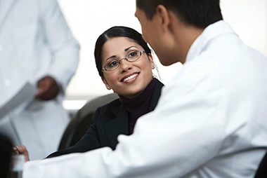 Image of 2 people talking.