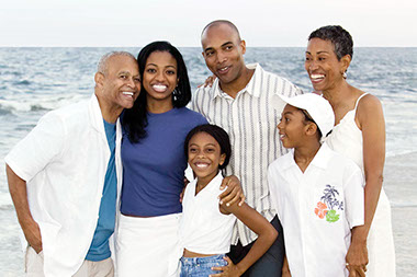 You can survive a family vacation with the in-laws. Image of multi-generation family at the beach.