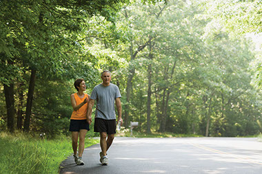 Image of middle-age couple walking.