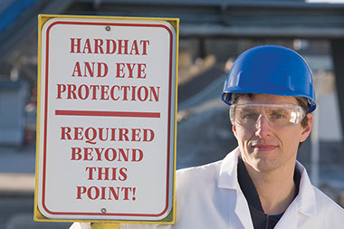 National safety month. Image of worder wearing proper hard-hat and protective eye glasses.