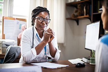 Image of doctor talking to patient.