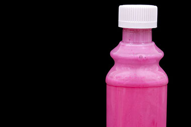 Image of medicine in pink bottle. Image of medicine in pink bottle.