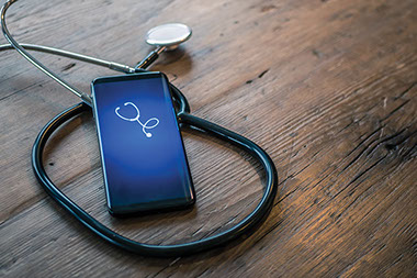 Phone and stethoscope. Phone and stethoscope.